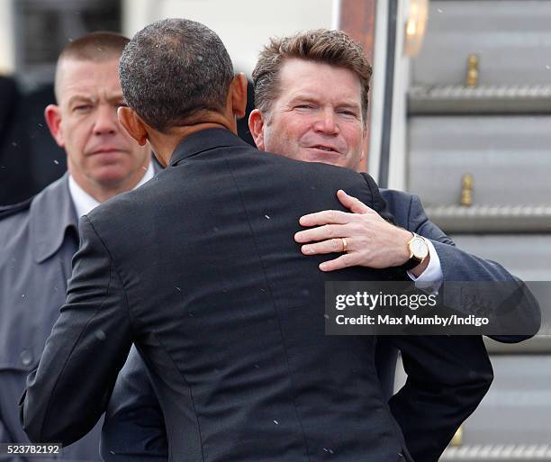 President Barack Obama hugs US Ambassador to the United Kingdom Matthew Barzun before boarding Air Force One at Stansted Airport after a four day...