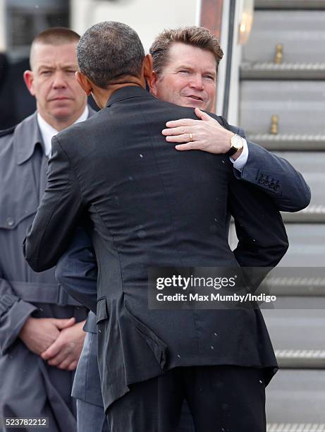 President Barack Obama hugs US Ambassador to the United Kingdom Matthew Barzun before boarding Air Force One at Stansted Airport after a four day...