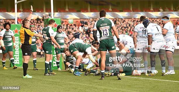Welsh Referee Nigel Owens awards a try to Maxime Machenaud of Racing Metro 92 after he scored his team's first try during the European Champions Cup...