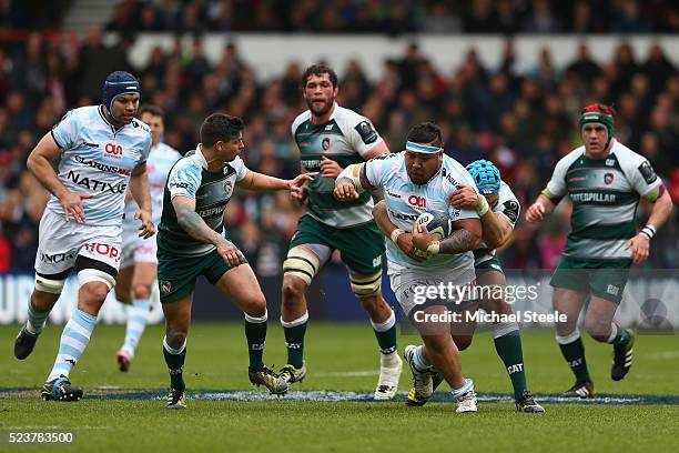 Ben Tameifuna of Racing 92 holds off the challenge of Graham Kitchener of Leicester as Ben Youngs closes in during the European Rugby Champions Cup...