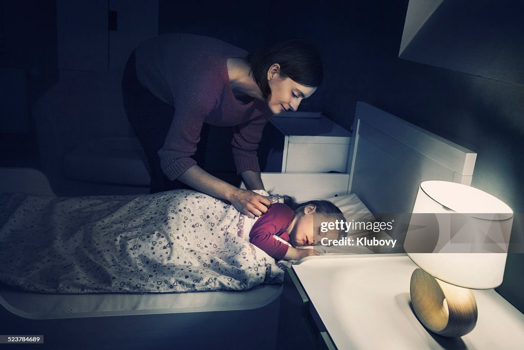 Mother lulling her daughter