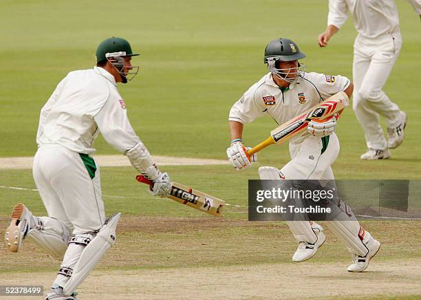 Graeme Smith and AB de Villiers of South Africa run a single during the second day of the second test against Zimbabwe at Supersport Park March 12,...