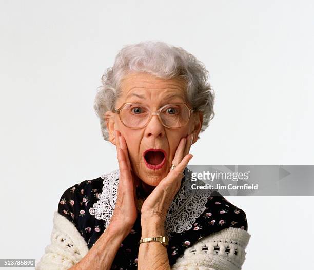 elderly woman looking surprised - awe expression stock pictures, royalty-free photos & images