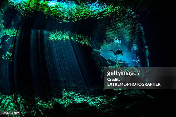 scuba diver in underwater cenotes - cenote mexico stock pictures, royalty-free photos & images