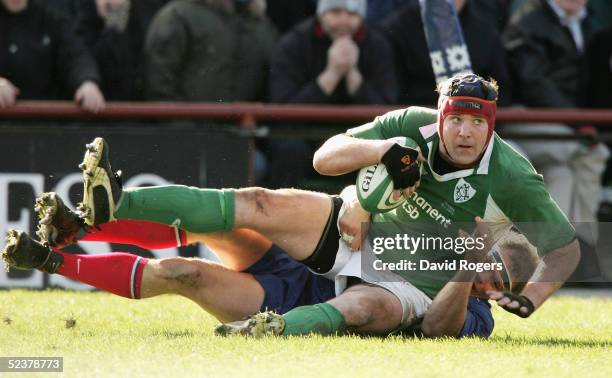 Anthony Foley of Ireland is taken to ground by Pieter DeVilliers of France during the RBS Six Nations Championship match between Ireland and France...