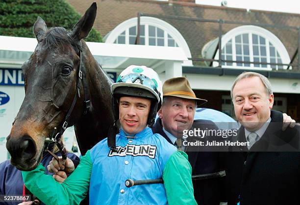Timmy Murphy, trainer Martin Pipe and owner David Johnson stand with Medison after the horses victory in The Sunderlands Imperial Cup Race run at...
