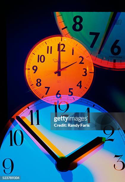 colorful clocks - daylight saving time foto e immagini stock