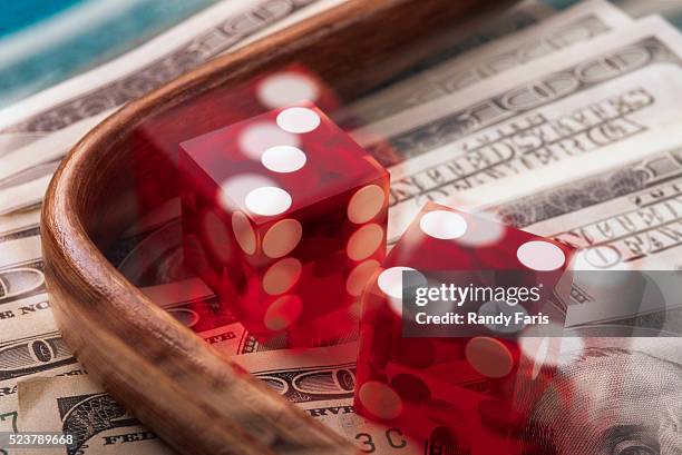 pair of dice over dollar bills - game of chance stock pictures, royalty-free photos & images
