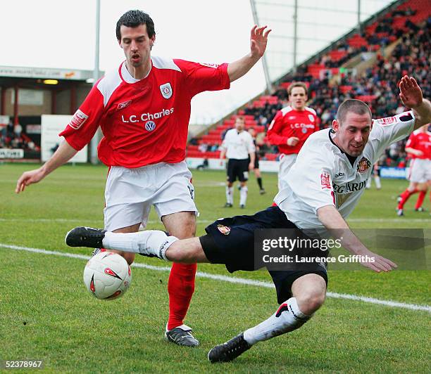 Stephen Wright of Sunderland battles for the ball with Anthony Tonkin of Crewe during the Coca-Cola Championship match between Crewe Alexandra and...