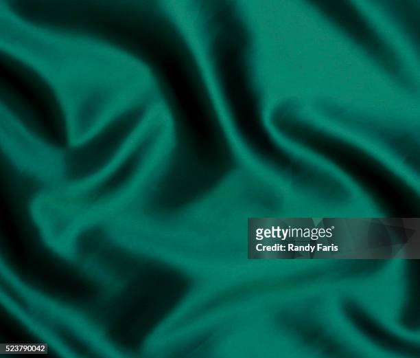 green satin - satin cloth stock pictures, royalty-free photos & images