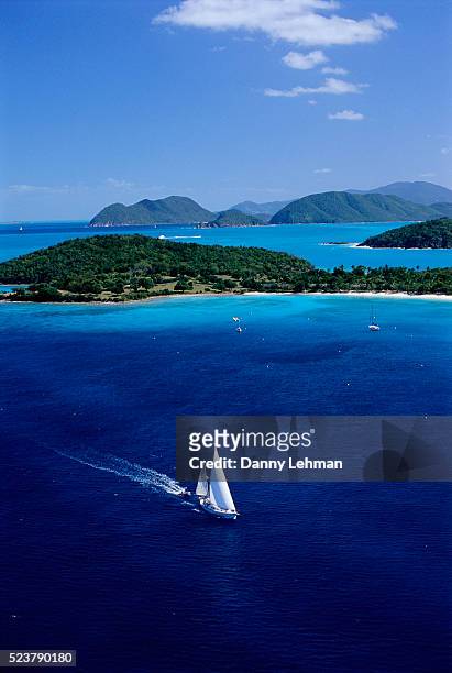 sailboat sailing past st. john - caribbean sea stock pictures, royalty-free photos & images