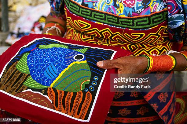 woman holding handcrafted mola - mola stock pictures, royalty-free photos & images