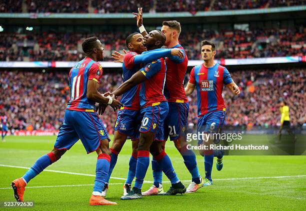 Yannick Bolasie of Crystal Palace celebrates with team mates as he score their first goal during The Emirates FA Cup semi final match between Watford...
