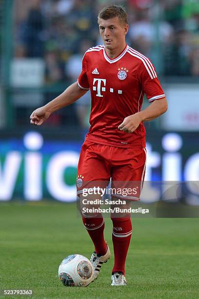 Toni Kroos of Muenchen runs with the ball during the Telekom Cup 2013 final match between Borussia Moenchengladbach and FC Bayern Muenchen at...