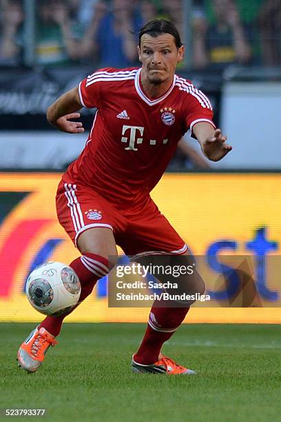 Daniel van Buyten of Muenchen runs with the ball during the Telekom Cup 2013 final match between Borussia Moenchengladbach and FC Bayern Muenchen at...