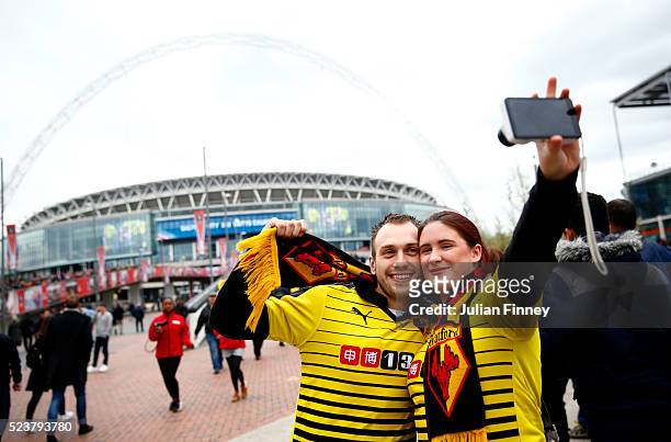 Watford fans pose for a selfie photograph prior to The Emirates FA Cup semi final match between Watford and Crystal Palace at Wembley Stadium on...