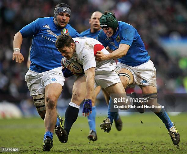 Andy Titterrell of England is dragged back by Silvio Orlando of Italy during the RBS Six Nations International between England and Italy at...