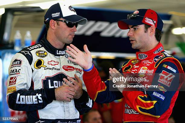 Teammates Jeff Gordon, driver of the DuPont Chevrolet and Jimmie Johnson, driver of the Lowe's Chevrolet talk in the garage during practice for the...