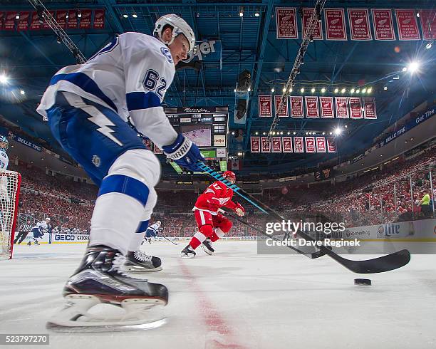 Andrej Sustr of the Tampa Bay Lightning skates around the net with the puck against the Detroit Red Wings in Game Four of the Eastern Conference...