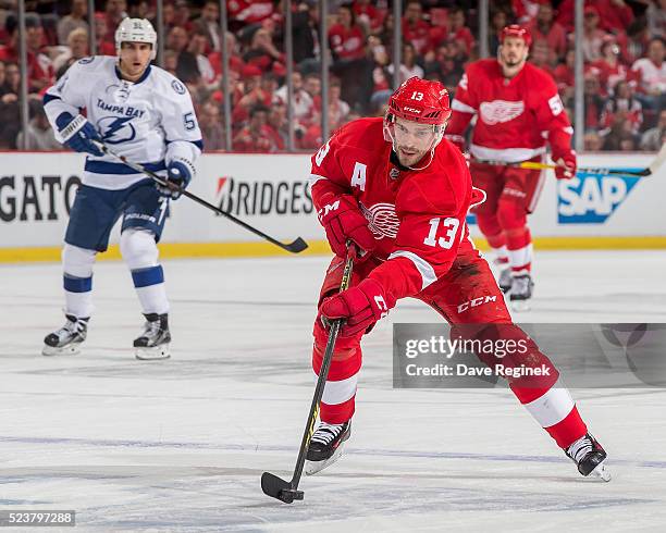 Pavel Datsyuk of the Detroit Red Wings skates up ice with the puck against the Tampa Bay Lightning in Game Four of the Eastern Conference First Round...