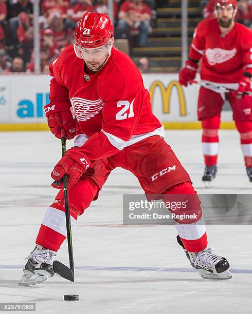 Tomas Tatar of the Detroit Red Wings skates up ice with the puck against the Tampa Bay Lightning in Game Four of the Eastern Conference First Round...