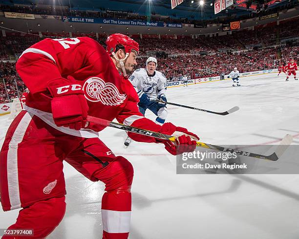 Jonathan Ericsson of the Detroit Red Wings clears the puck in front of Ondrej Palat of the Tampa Bay Lightning in Game Four of the Eastern Conference...