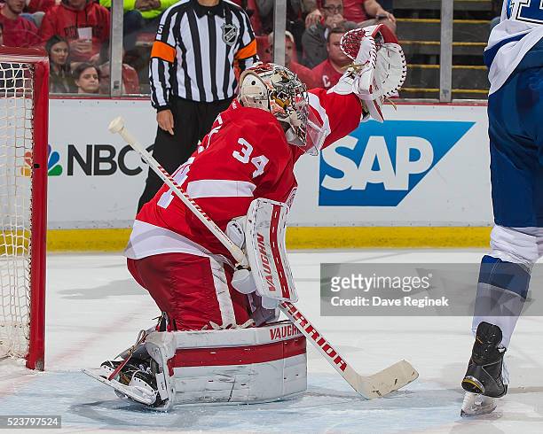 Petr Mrazek of the Detroit Red Wings makes a glove save against the Tampa Bay Lightning in Game Four of the Eastern Conference First Round during the...