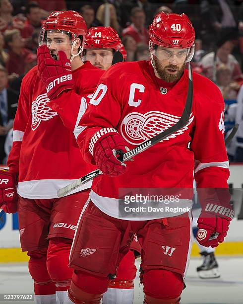 Henrik Zetterberg of the Detroit Red Wings skates to the face off circle in front of teammates Dylan Larkin and Gustav Nyquist in Game Four of the...