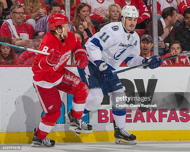 Justin Abdelkader of the Detroit Red Wings battles along the boards with Brian Boyle of the Tampa Bay Lightning in Game Four of the Eastern...