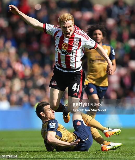 Duncan Watmore of Sunderland vies with Laurent Koscielny of Arsenal during the Barclays Premier League match between Sunderland and Arsenal at The...