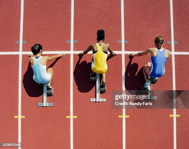 runners at starting line - rivalry stock pictures, royalty-free photos & images