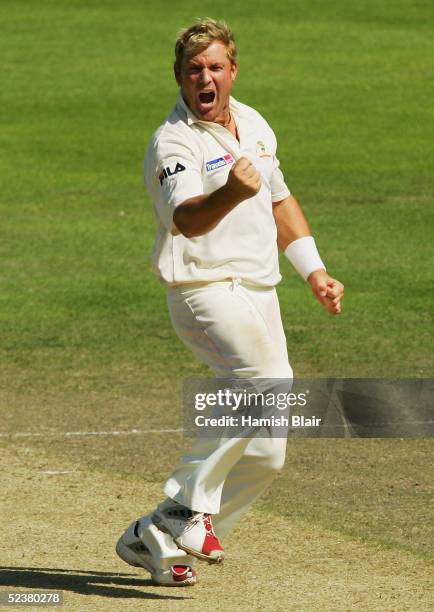 Shane Warne of Australia celebrates the wicket of Chris Martin of New Zealand during day four of the 1st Test between New Zealand and Australia...