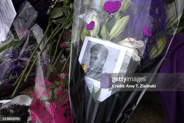 Candles, purple flowers, notes of condolences, and images of musician and recording artist Prince are left at a makeshift memorial to the artist...