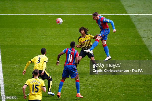 Connor Wickham of Crystal Palace rises above Nathan Ake of Watford to score his team's second goal during the The Emirates FA Cup Semi Final between...