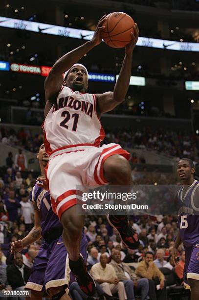 Hassan Adams of the Arizona Wildcats puts up a shot against the Washington Huskies during the 2005 Pacific Life Pac-10 Men's Basketball Tournament...