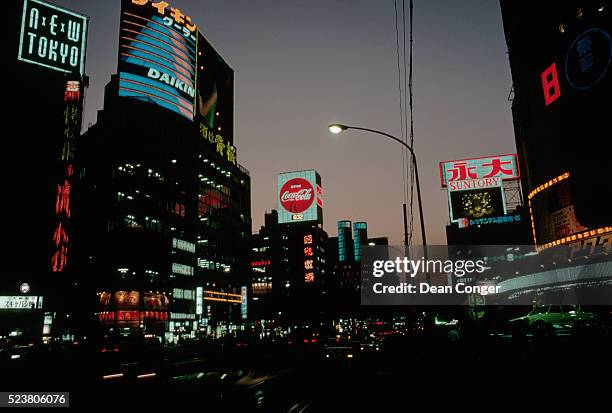 tokyo shopping district lit up at night - showa period fotografías e imágenes de stock