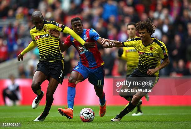 Wilfried Zaha of Crystal Palace battles with Allan-Romeo Nyom and Nathan Ake of Watford during The Emirates FA Cup semi final match between Watford...