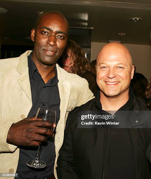 Actors Michael Jace and Michael Chiklis pose at the afterparty for the 4th season screening premiere of FX's "The Shield" at Meson G Resturaunt on...