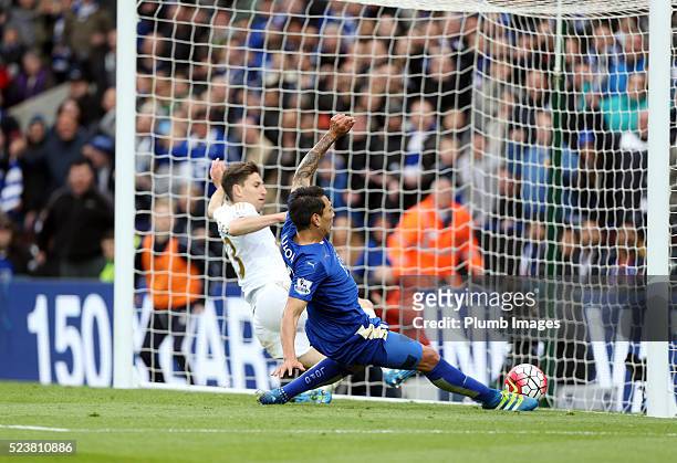 Leonardo Ulloa of Leicester City beats Federico Fernandez of Swansea to the ball to score to make it 3-0 during the Barclays Premier League match...