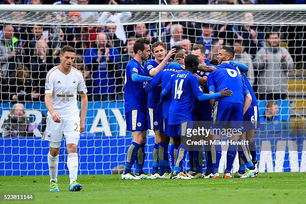 Marc Albrighton of Leicester City celebrates with team mates as he scores their fourth goal during the Barclays Premier League match between...