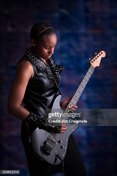 teen aged african american musician playing a custom built electric guitar - jim craigmyle guitar stock pictures, royalty-free photos & images