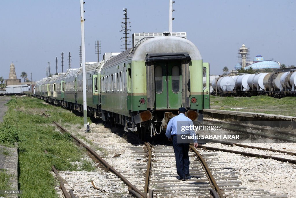 Iraq Train Rote An Iraqi railway worker walks on the tracks at the main train station ...