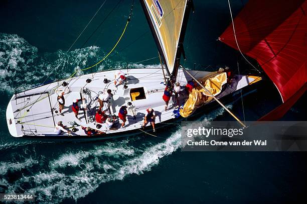 crew on deck of numbers sailboat - sailing competition stock pictures, royalty-free photos & images