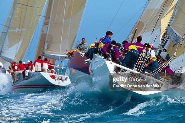 sailboat crew in the stern of the champosa during race - sailing competition stock pictures, royalty-free photos & images