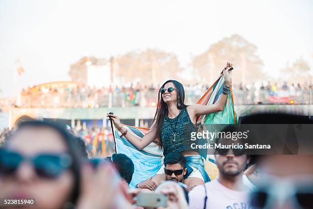 Music fan with a Tomorrowland flag during the third day of the Tomorrowland music festival at Parque Maeda Itu on April 23, 2016 in Sao Paulo, Brazil.