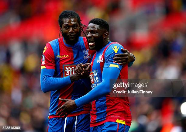 Emmanuel Adebayor and Bakary Sako of Crystal Palace celebrate their team's victory following The Emirates FA Cup semi final match between Watford and...