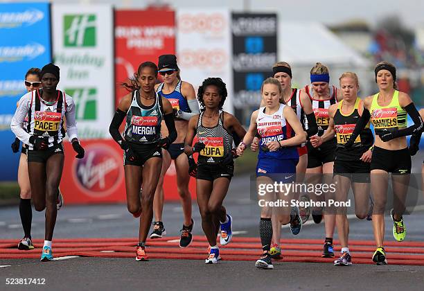 Aselefech Mergia and Tigist Tufa of Ethiopia start alongside Charlotte Purdue of Great Britain during the Virgin Money London Marathon on April 24,...