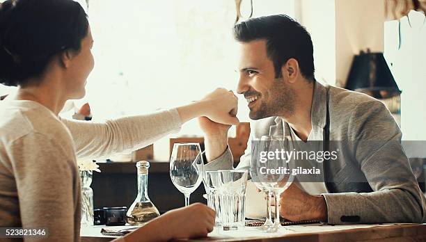 couple in restaurant. - 1 year anniversary stock pictures, royalty-free photos & images