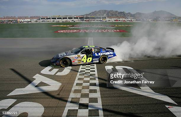 Jimmie Johnson, driver of the Lowe's Chevrolet celebrates his victory during the NASCAR Nextel Cup UAW - Daimler Chrysler 400 on March 13, 2005 at...