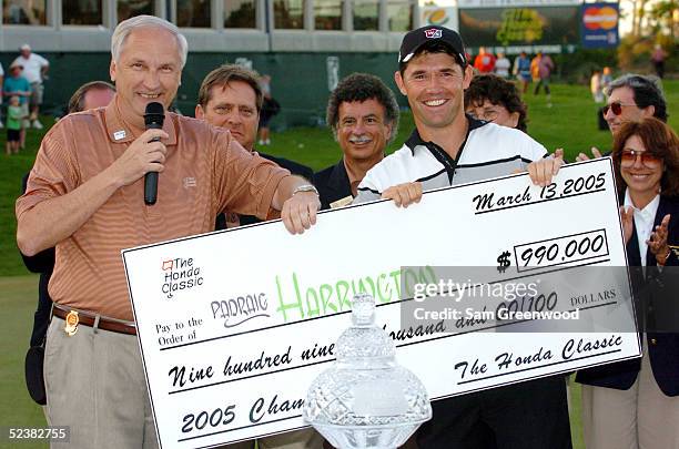 Padraig Harrington of Ireland receives the winner's check after the final round of the Honda Classic on March 13, 2005 at the CC of Mirasol in Palm...